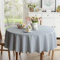 Obrus szary z delikatnym haftem na okrągłym stole, plamoodporny - dekoracja stołu Wielkanoc.